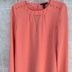 Salmon shift dresses with gold metal accents